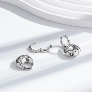 Polished silver croissant drop earrings in stainless steel with textured wavy design