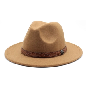 Detail of camel wool fedora with brown patterned band and vintage silver buckle