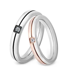 Minimalist stainless steel couple ring set with sparkling CZ stone and polished finish