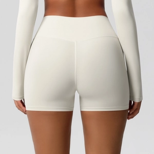Detail of high waisted yoga shorts showing peach lift effect and matte brushed fabric