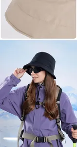Detail of winter warm bucket hat featuring windproof drawstring and waterproof material