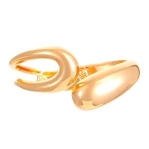 Macro detail of glossy gold chunky cuff bracelet featuring irregular fluid streamline design