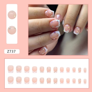 Short ballet French press-on nails with white tips and colorful rhinestones in 24pcs set