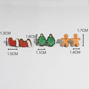 Detailed view of wooden Christmas earrings with size dimensions for sock tree and gingerbread man