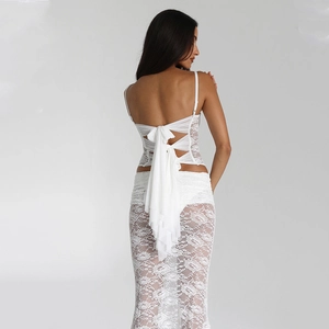 Elegant white lace two-piece set featuring backless tie-up top and sheer skirt for women