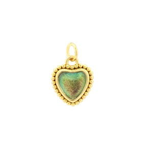 Close-up of heart-shaped 18K gold-plated pendant with sparkling green crystal inlay