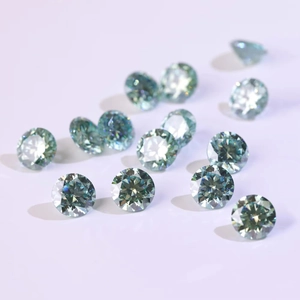Macro shot of high-quality round brilliant cut cyan moissanite gemstones with fire