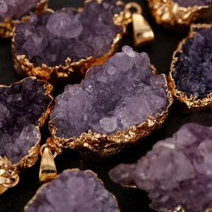 Natural purple amethyst geode pendant with gold-plated edges and metal clip