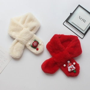 Detail of plush Christmas scarves in red and white with snowflake balls and Santa patches
