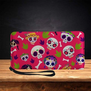 Sugar skull long zipper wallet with wrist strap on a rustic wood surface