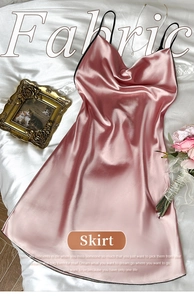 Detailed view of pale pink satin fabric texture on a V-neck strapless summer sleepwear dress