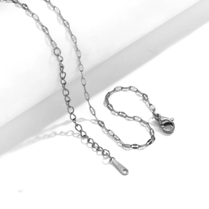 Detail of a stainless steel necklace chain featuring a lobster clasp and S-STEEL engraving