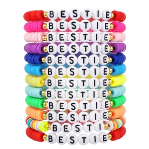 Colorful Bohemian clay bead bestie bracelets stacked on a clean white background