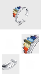 Detailed macro view of S925 hallmark on polished silver ring with rainbow zircon pavé
