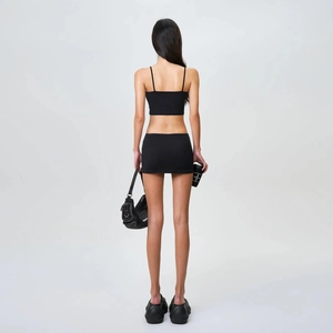 Back view of a black two-piece slim fit mini skirt set with thin straps and open back