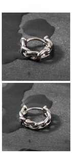 Detail of silver chain huggie earrings in 8mm and 10mm sizes on dark stone background