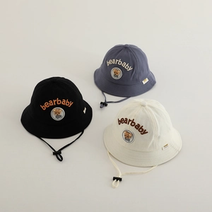Detail of baby sun hats featuring bear embroidery and adjustable windproof straps