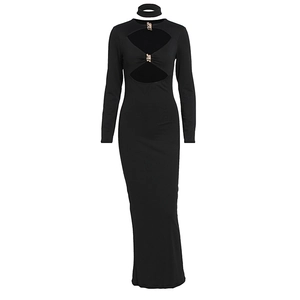 Detail of elegant black long sleeve maxi dress with chest cut-outs and metal accent