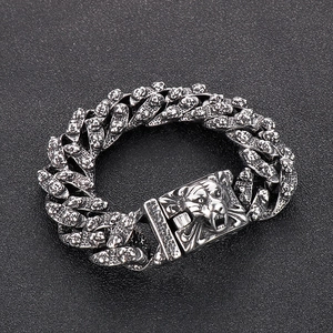 Close-up of vintage titanium steel men's bracelet with detailed tiger head carvings