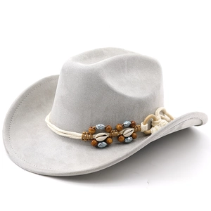 Detail of western cowboy hat with ethnic beads and shell trim on wide brim