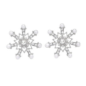 Close-up detail of silver snowflake stud earrings with sparkling crystals and white pearls