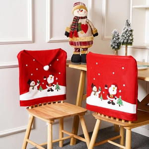 Christmas chair covers featuring Santa and Snowman prints with red pointed hat design