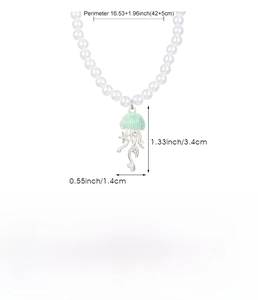 Detail view of jellyfish pendant necklace with size specs in inches and centimeters