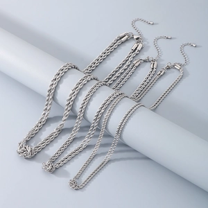 Detail of silver twisted rope chains in various thicknesses with high metal texture