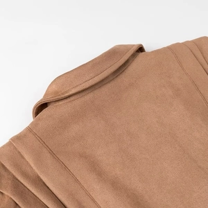 Detail of collar and shoulder seams on brown suede moto jacket for women