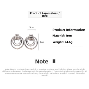 Detail of silver geometric multi-layer hoop earrings showing 5x6cm size and 24.6g weight