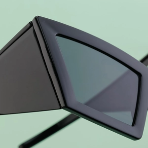 Macro view of wide temples and sturdy hinge joints on these black oversized sunglasses