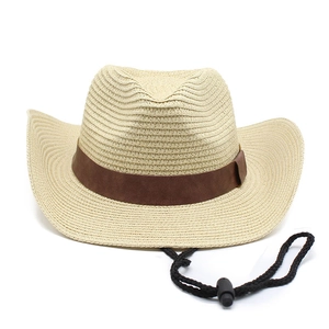 Detail of woven straw cowboy hat with brown leather band and adjustable chin strap