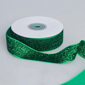 Detail of 2.5cm emerald green glitter velvet ribbon roll for gift wrapping and DIY crafts