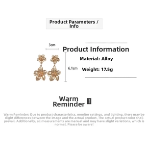 Detail view of gold layered flower drop earrings with dimensions of 3cm by 6.1cm