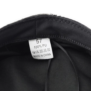Detail of black PU leather hat interior featuring size 57 label and adjustable drawstring