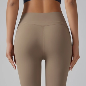 Rear view of high-waisted seamless yoga pants in sand brown with glute-lifting seams