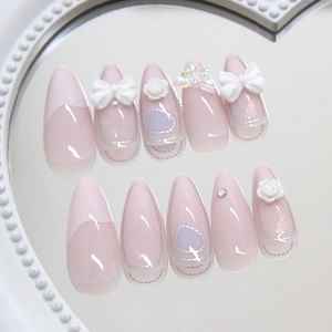 French style press-on nails in pink and purple with 3D bows, roses and laser butterfly