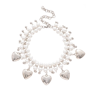 Double-layer faux pearl necklace with five silver heart pendants on white background