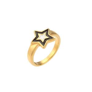 Minimalist gold star ring with black enamel border and white center on white background