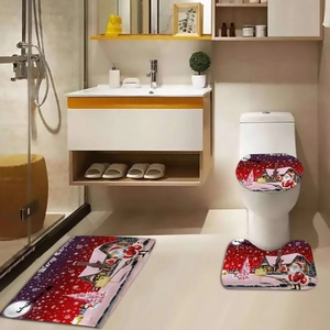 Detailed view of Merry Christmas themed 3-piece bathroom rug set with Santa Claus patterns