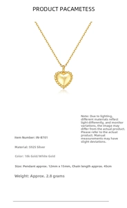 Macro detail of S925 sterling silver heart pendant with 18k gold finish and beaded texture