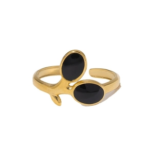 Gold-plated open branch ring with black enamel oval accents on white background