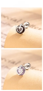 Macro detail of 7mm heart-shaped stud earrings with inlaid zircon and screw back