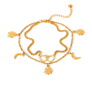 Double-layer golden anklet with heart, sun and moon charms on white background