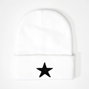 Minimalist white knit beanie with a black embroidered star on a clean white background