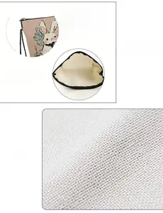 Détail de la trousse à lapin montrant la texture du lin et la fermeture éclair en alliage