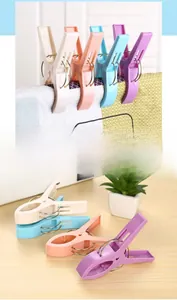 Detail of heavy-duty windproof plastic clothespins with strong springs for drying quilts