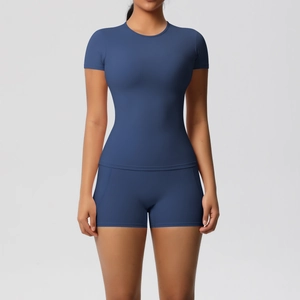 Detail of navy blue brushed nylon yoga set featuring high-waisted shorts and a crew neck top