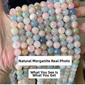 Detailed view of colorful natural morganite beads showing soft pink and blue pastel tones