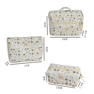 Three-piece set of almond yellow floral corduroy cosmetic bags in various sizes